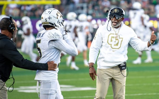 Colorado head football coach Deion Sanders gives instructions to wide receiver Jimmy Horn Jr. (5) vs. CSU in Rocky Mountain Showdown at Canvas Stadium on September 14, 2024, Fort Collins, Colo.