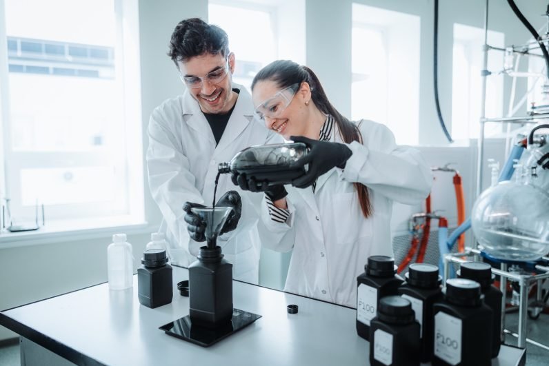 Two scientists in the Up Catalyst lab, which converts CO2 emissions into green carbon products 